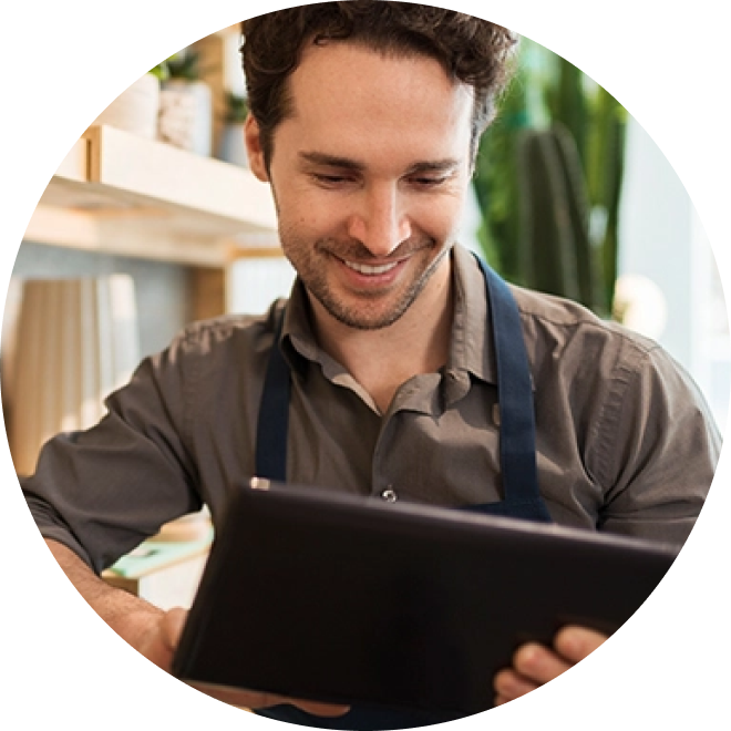 merchant business owner viewing tablet screen