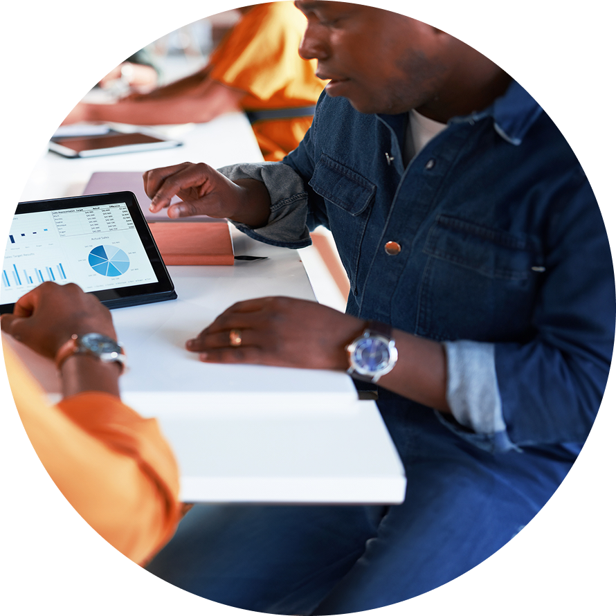 business people meeting and looking at a tablet screen