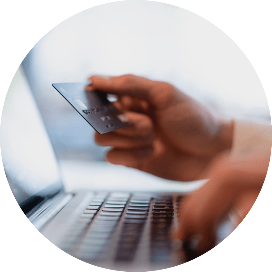 close up view typing card number into computer