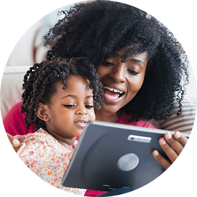mom and daughter making online purchase on tablet