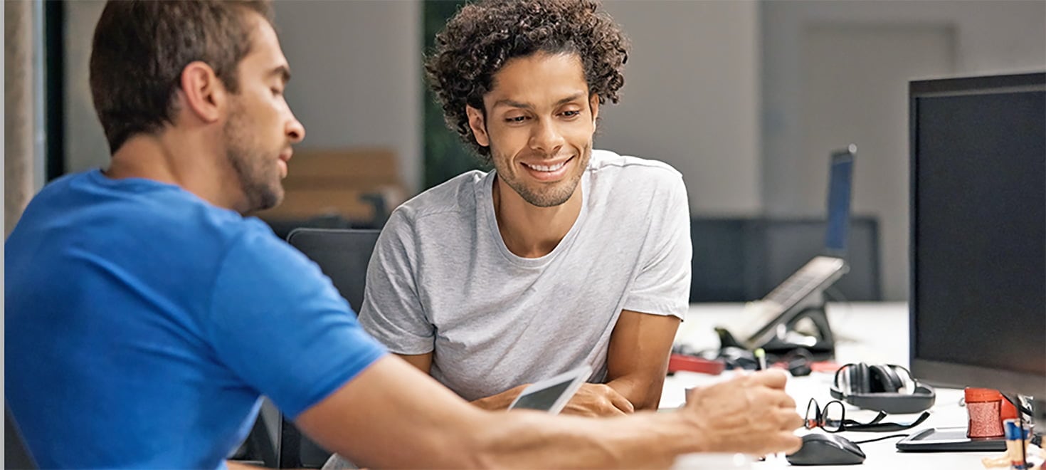 two co-workers reviewing work