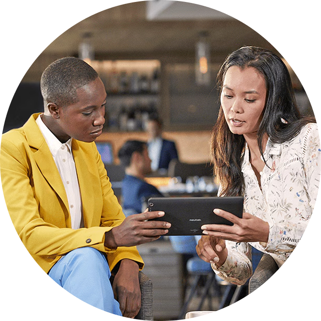 two business owners exploring card solutions on a tablet